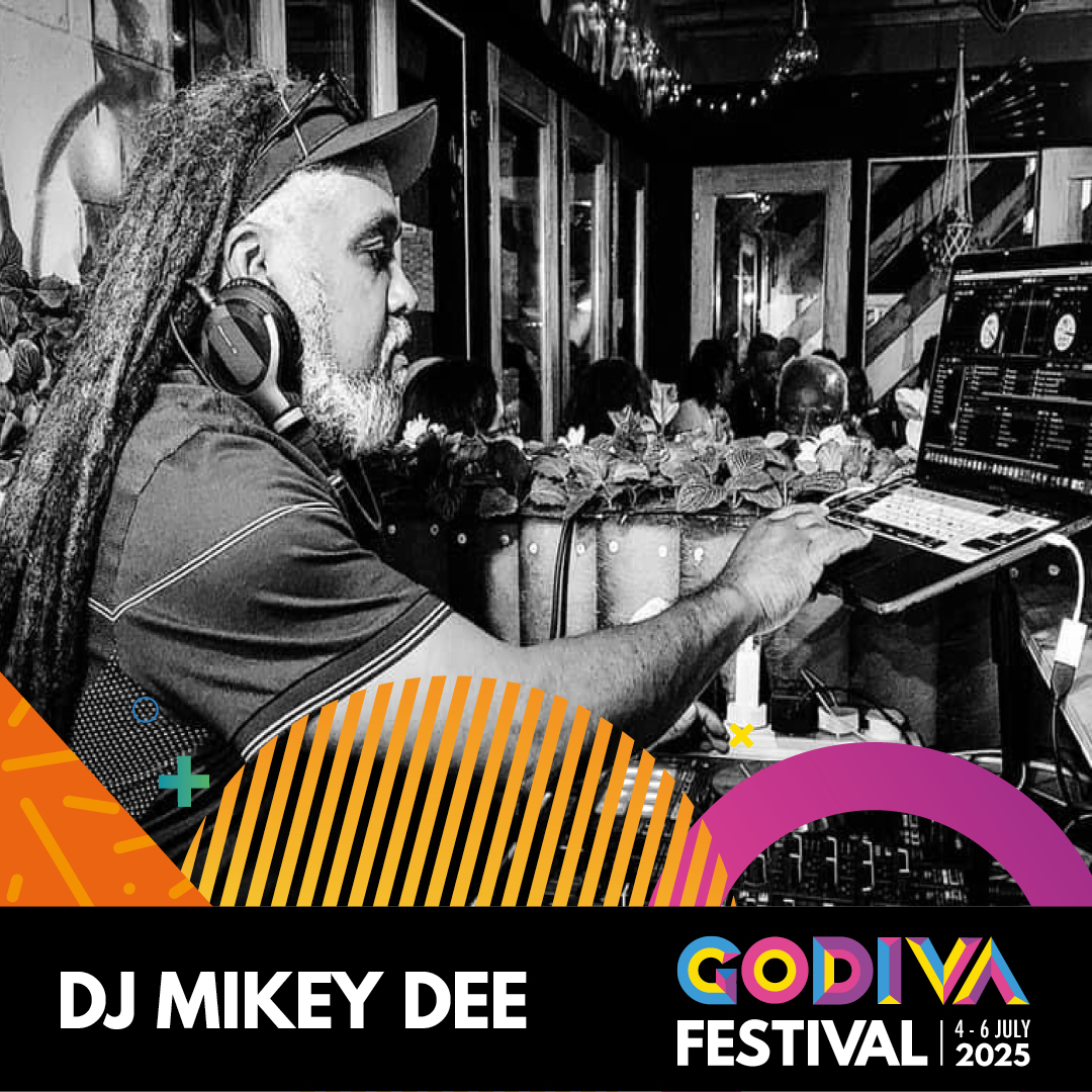 Close up of D J Mikey Dee in black and white with coloured Godiva logo at the bottom