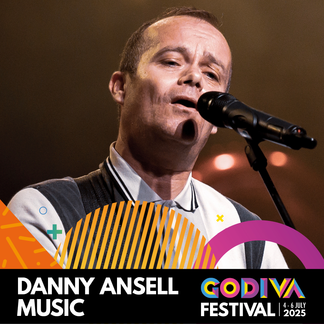 Head shot of Danny singing into a microphone.  Name and Godiva logo at bottom