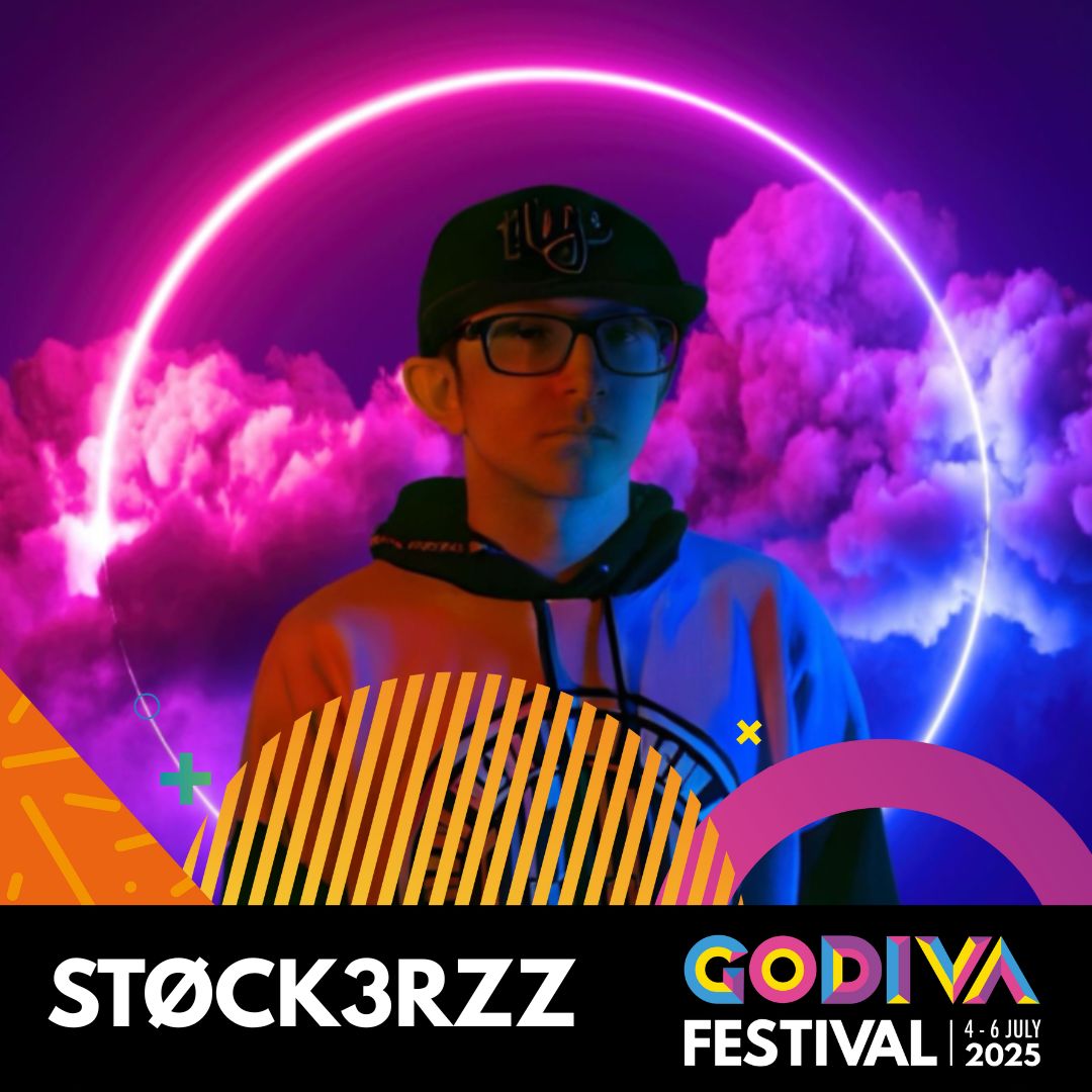 person standing in front of a circular neon sign with pink and purple clouds in the background