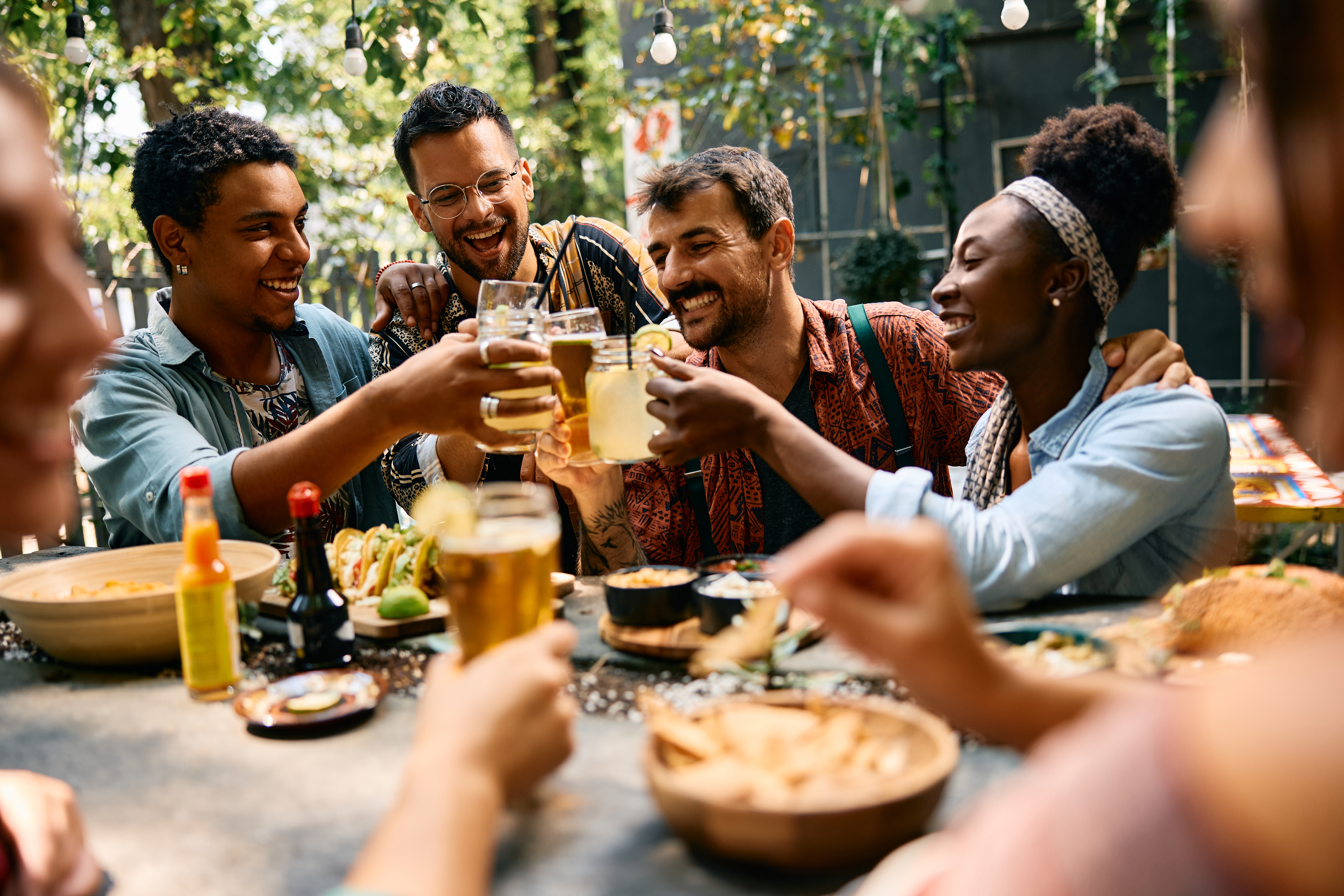 Photo of group of people sat down enjoying drinks